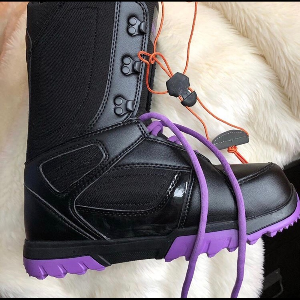 Thirty two black and purple snowboard boots